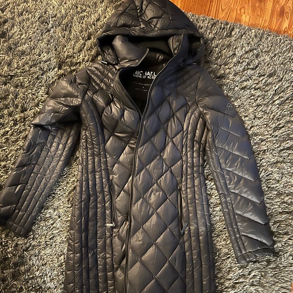 It beautiful packable down-fill light coat worn twice still brand-new.